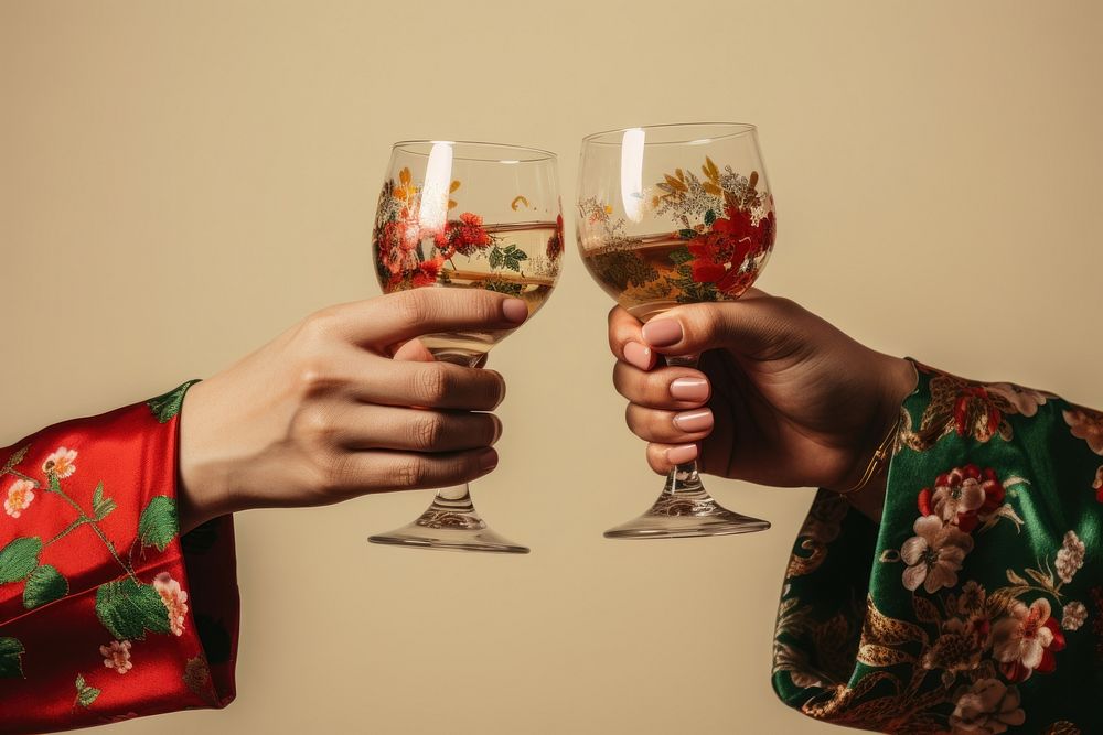 2 hands in Taiwanese outfit toasting celebration glass drink. AI generated Image by rawpixel.