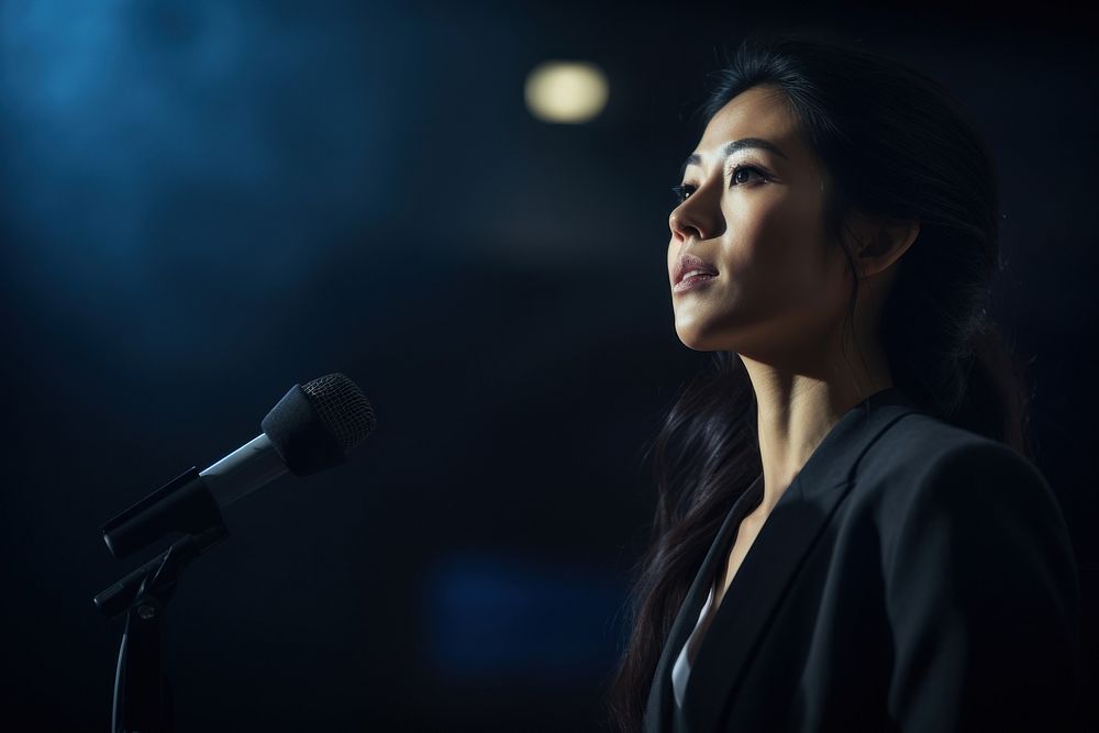 An American-Korean woman in formal outfit microphone portrait adult. AI generated Image by rawpixel.