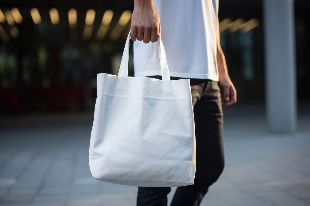 A white large tote bag handbag adult man. AI generated Image by rawpixel.