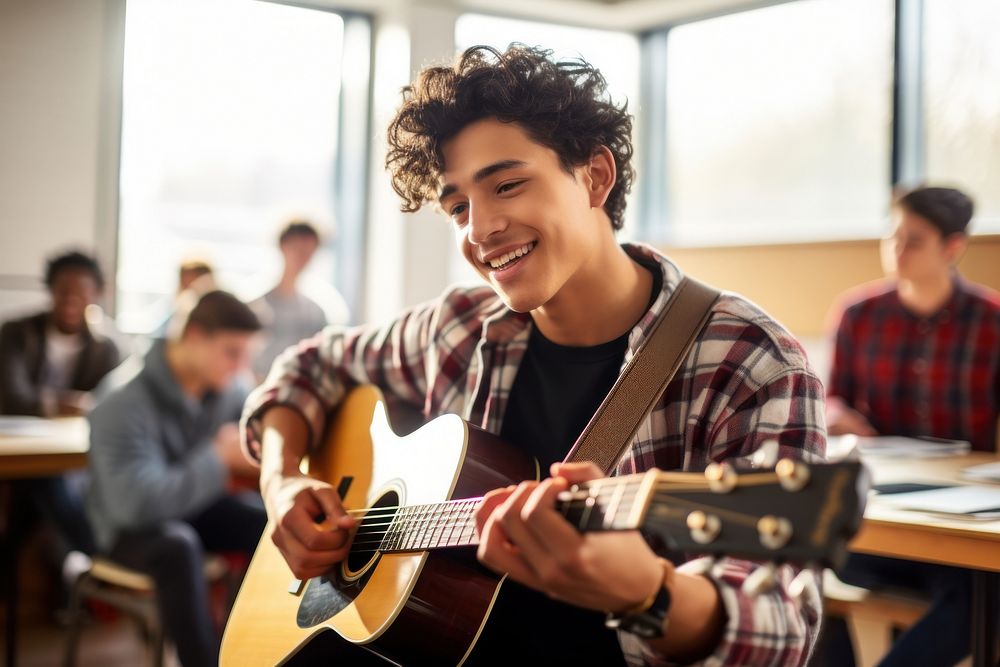 A Latinx boy high school student playing guitar musician adult concentration. AI generated Image by rawpixel.