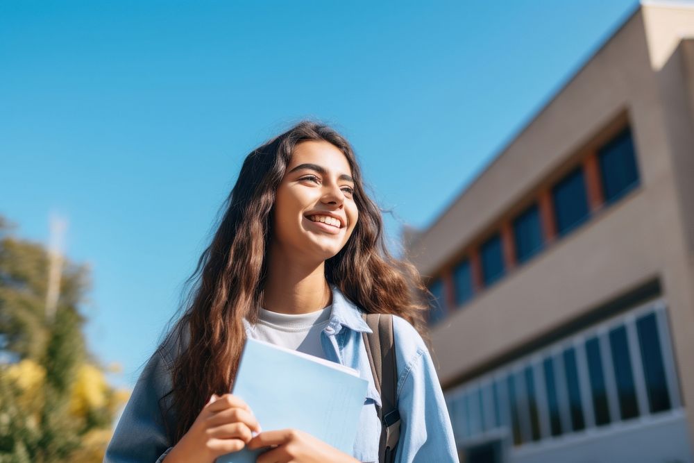 A Latinx girl high school student holding summer smile. AI generated Image by rawpixel.