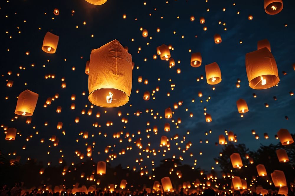 Sky lanterns in the night sky lighting spirituality illuminated. AI generated Image by rawpixel.