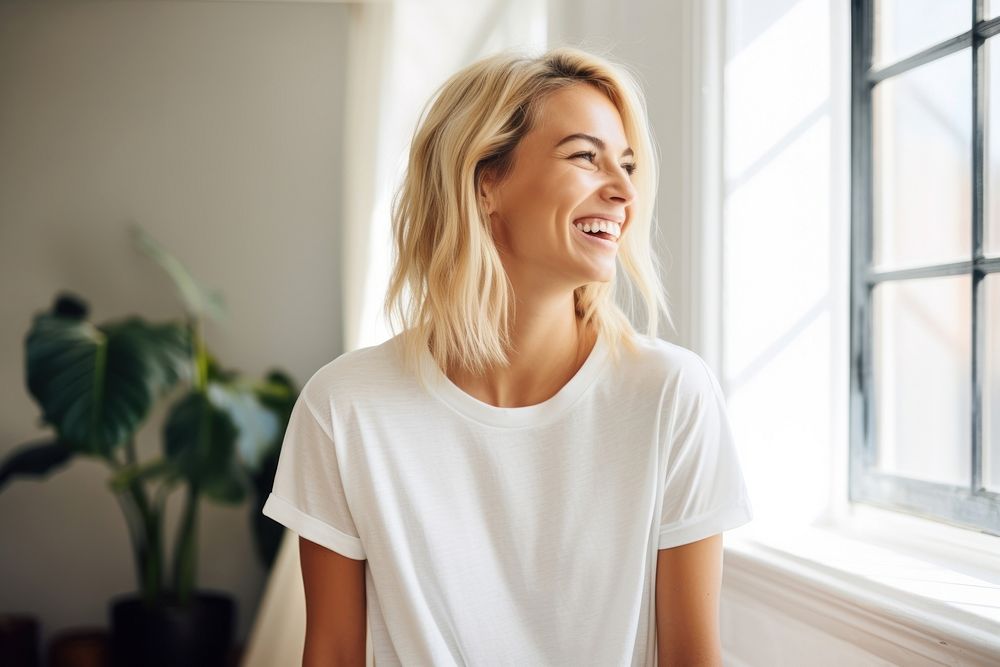 A woman talking to someone laughing t-shirt blonde. AI generated Image by rawpixel.