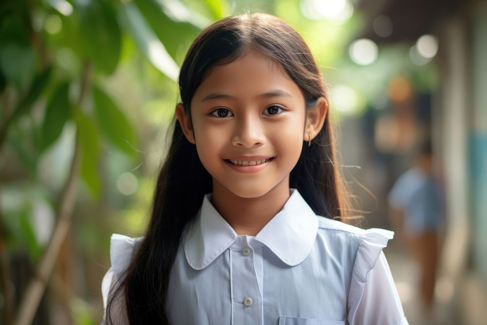 Southeast Asian student child smile happy. AI generated Image by rawpixel.