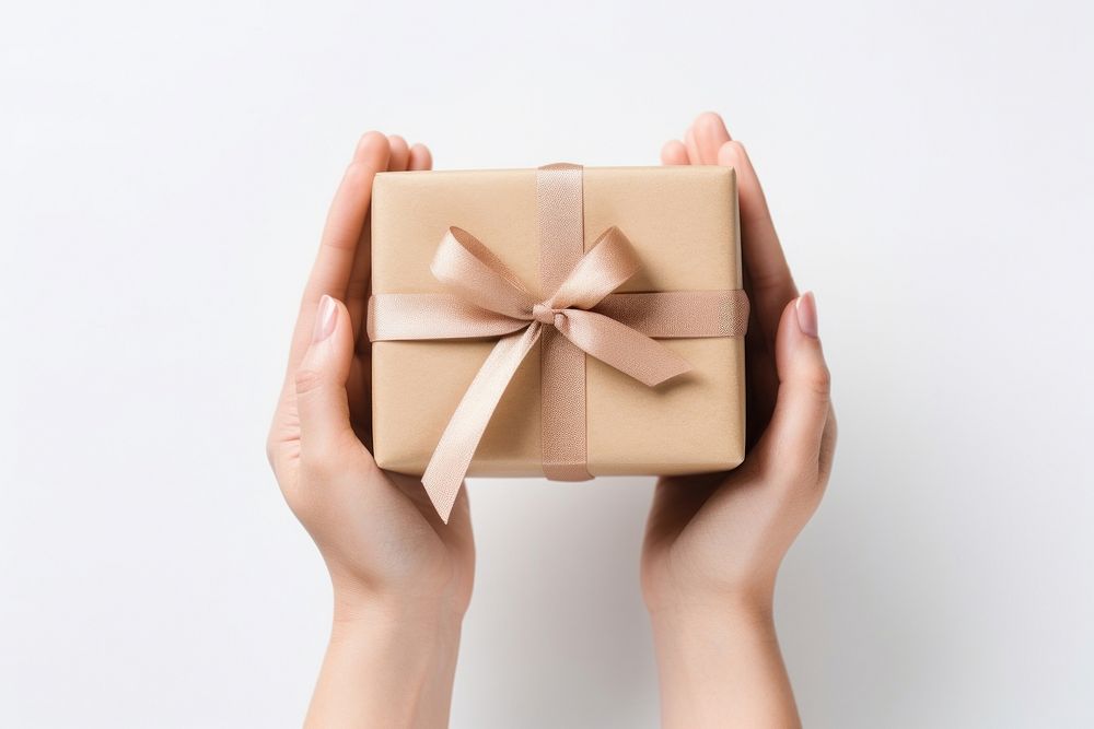 Gift box holding hand white background. AI generated Image by rawpixel.