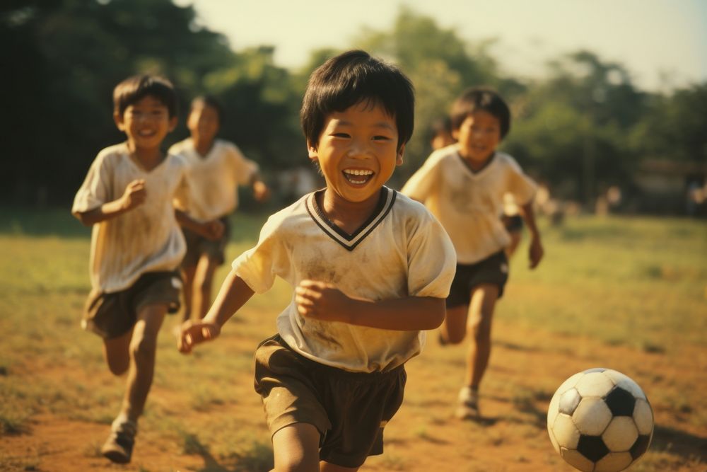 Thai children playing football sports togetherness competition. AI generated Image by rawpixel.