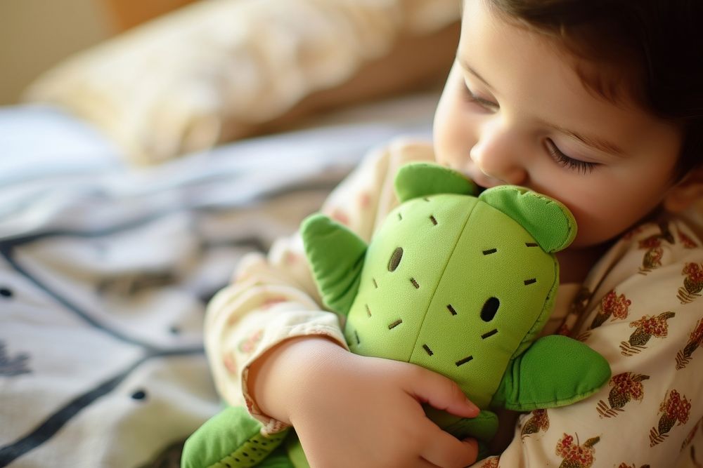 Baby hugging a cactus fabric toy portrait photo representation. AI generated Image by rawpixel.