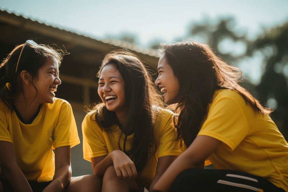 3 Malaysian girls sport team talking at each other laughing sports joy. AI generated Image by rawpixel.