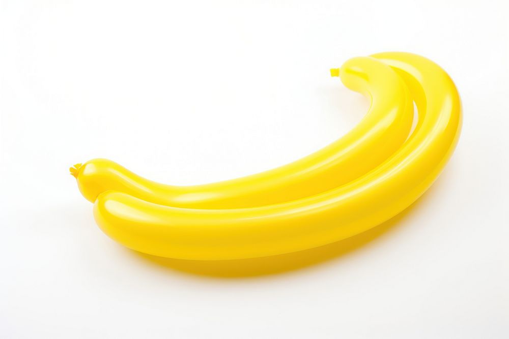 Balloon twisting in the shape of banana food white background freshness. AI generated Image by rawpixel.