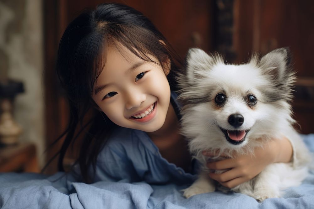 Photo of Chinese little girl playing with a dog pet happiness portrait. AI generated Image by rawpixel.