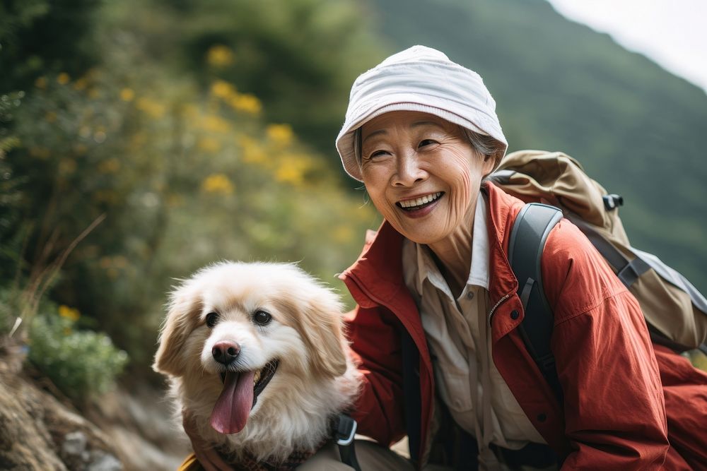 Photo of chinese senior woman hiking with dog smile happy pet portrait mammal. AI generated Image by rawpixel.