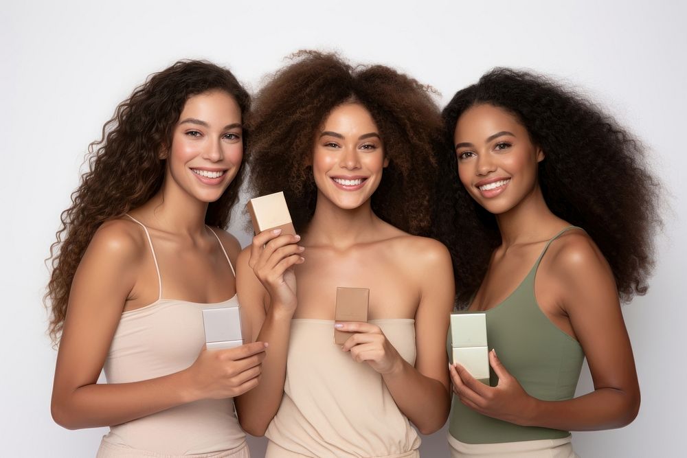 A group of Female models in different races holding cosmetics female adult smile. AI generated Image by rawpixel.