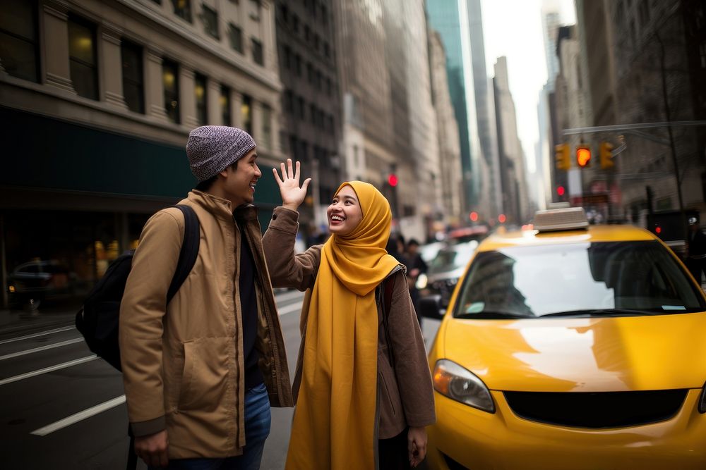 Indonesian teenage couple hailing a taxi in new york vehicle travel street. AI generated Image by rawpixel.