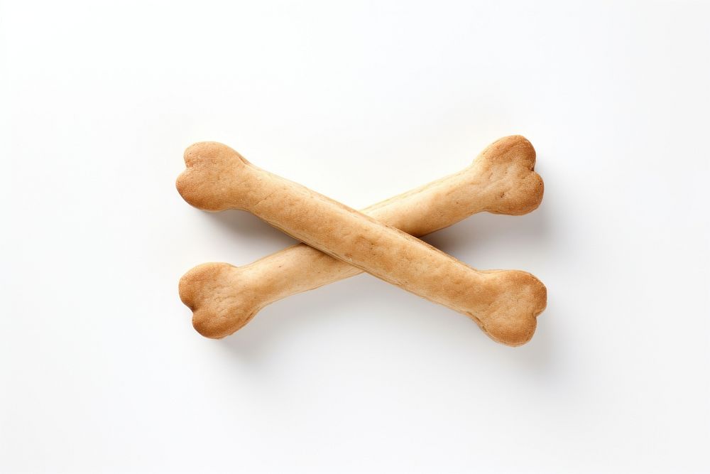 Bone-shaped biscuit dog snacks dessert food white background. AI generated Image by rawpixel.