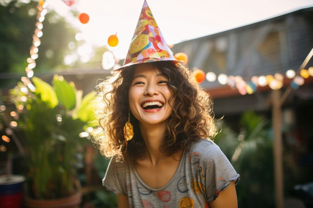 Cheerful Singaporean woman birthday laughing party. AI generated Image by rawpixel.