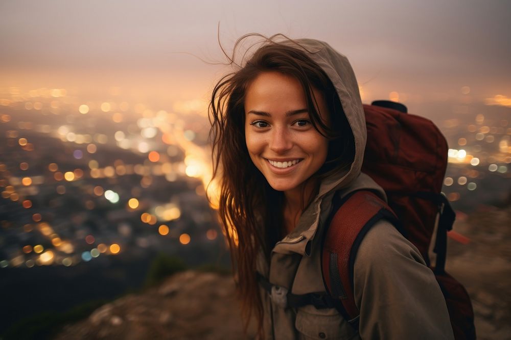 A Latina Brazilian female backpacker joyfully exploring Los Angeles during the nighttime nature portrait outdoors. AI…
