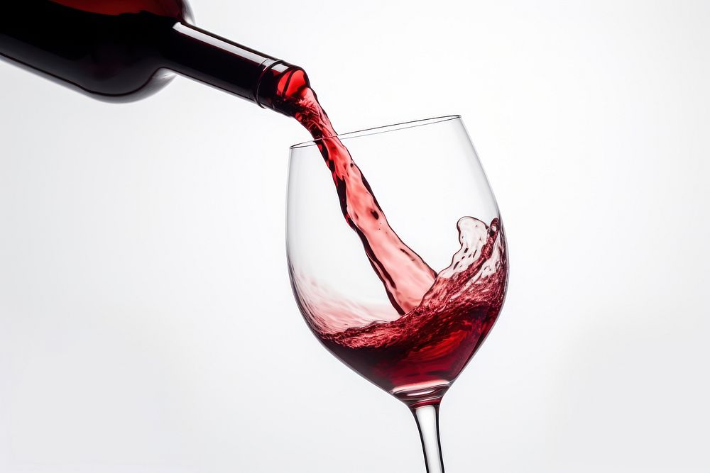 Pouring red wine in a glass pouring drink refreshment. AI generated Image by rawpixel.