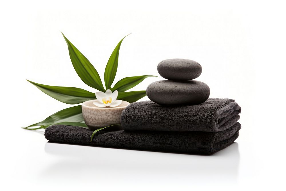 Spa concept with zen basalt stones and towels plant spa white background. AI generated Image by rawpixel.