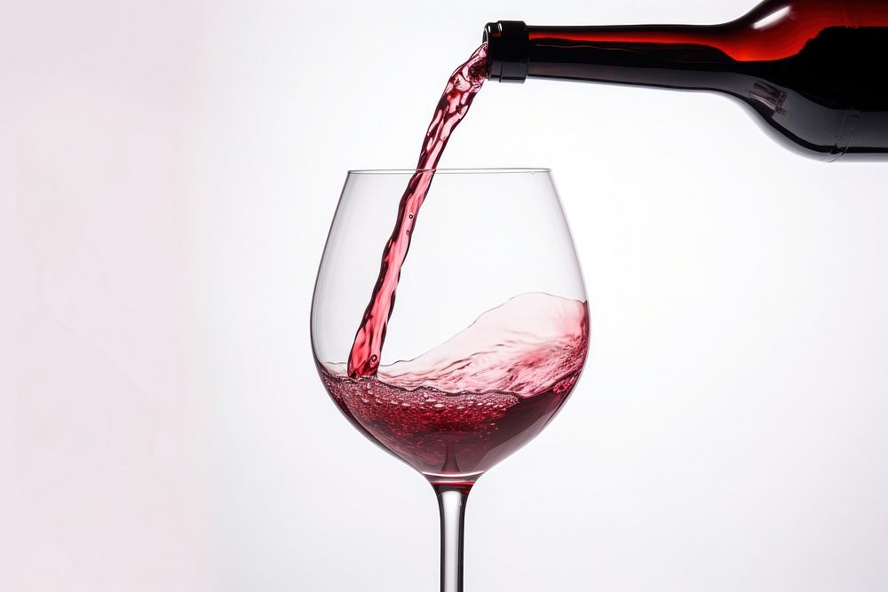 Pouring a glass of red wine pouring bottle drink. AI generated Image by rawpixel.