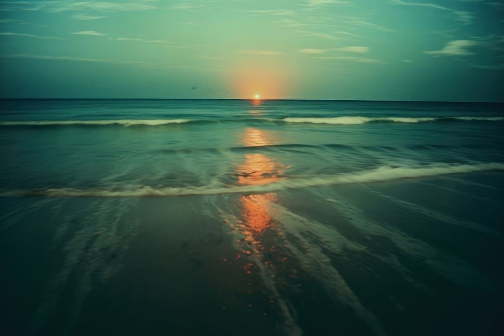 The beach at night landscape sunlight outdoors. AI generated Image by rawpixel.