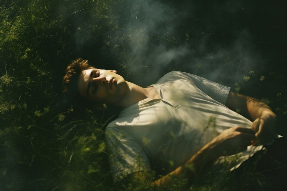 man laying comfortably grass photography | Free Photo - rawpixel