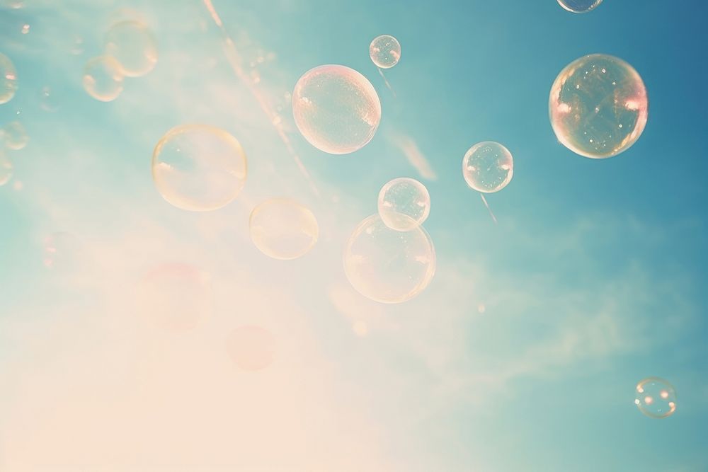 A soap bubbles floating in the sky backgrounds outdoors nature. AI generated Image by rawpixel.