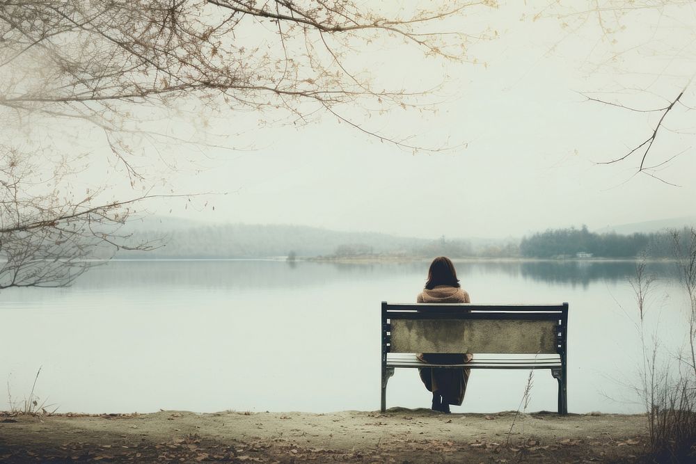 A woman sitting on a bench reading a book lake outdoors nature. AI generated Image by rawpixel.