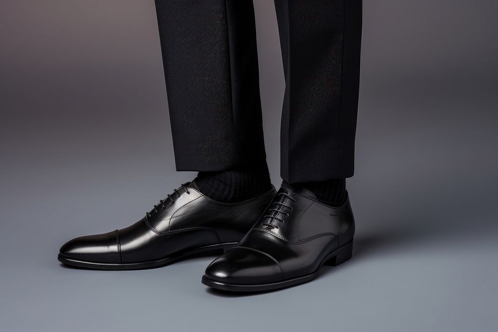 A person wearing a pair of shoes footwear adult studio shot. AI generated Image by rawpixel.