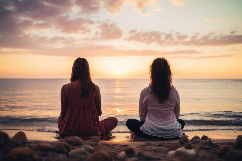 Female friends sitting in a lotus pose meditating outdoors nature. AI generated Image by rawpixel.