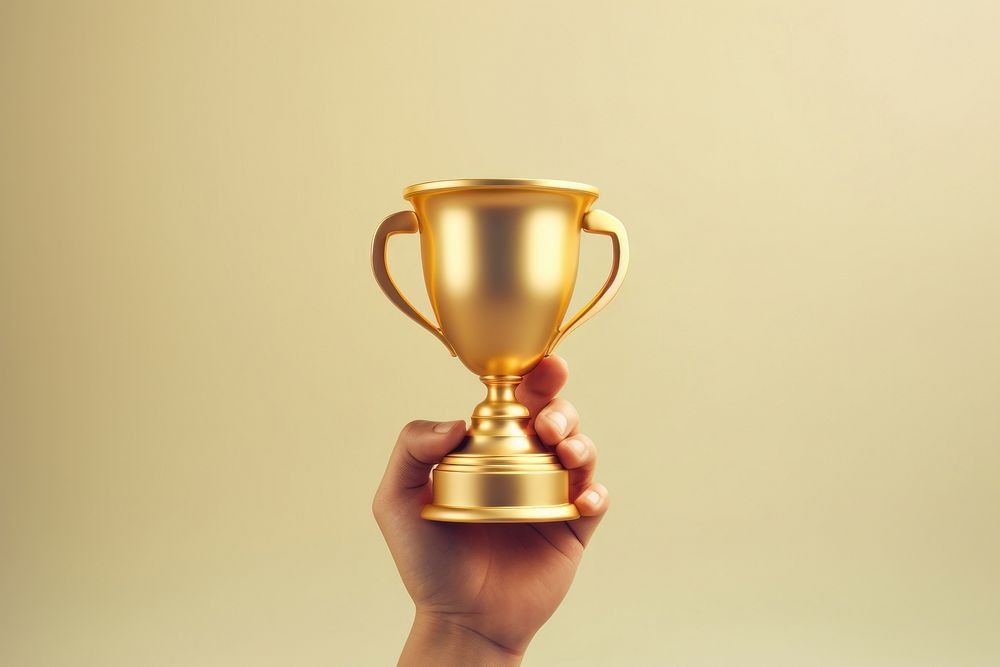 Hand holding a golden trophy cup achievement investment success. AI generated Image by rawpixel.
