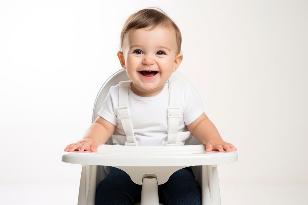 Baby sitting in a high chair with a happy face portrait white photo. AI generated Image by rawpixel.