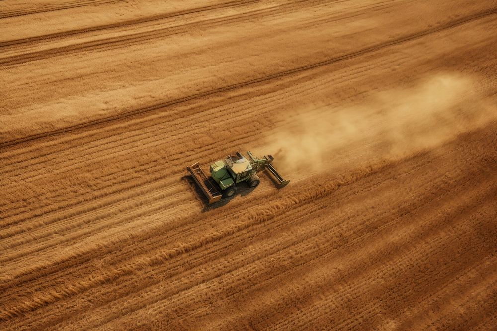 Tractor on the harvest field outdoors nature farm. AI generated Image by rawpixel.