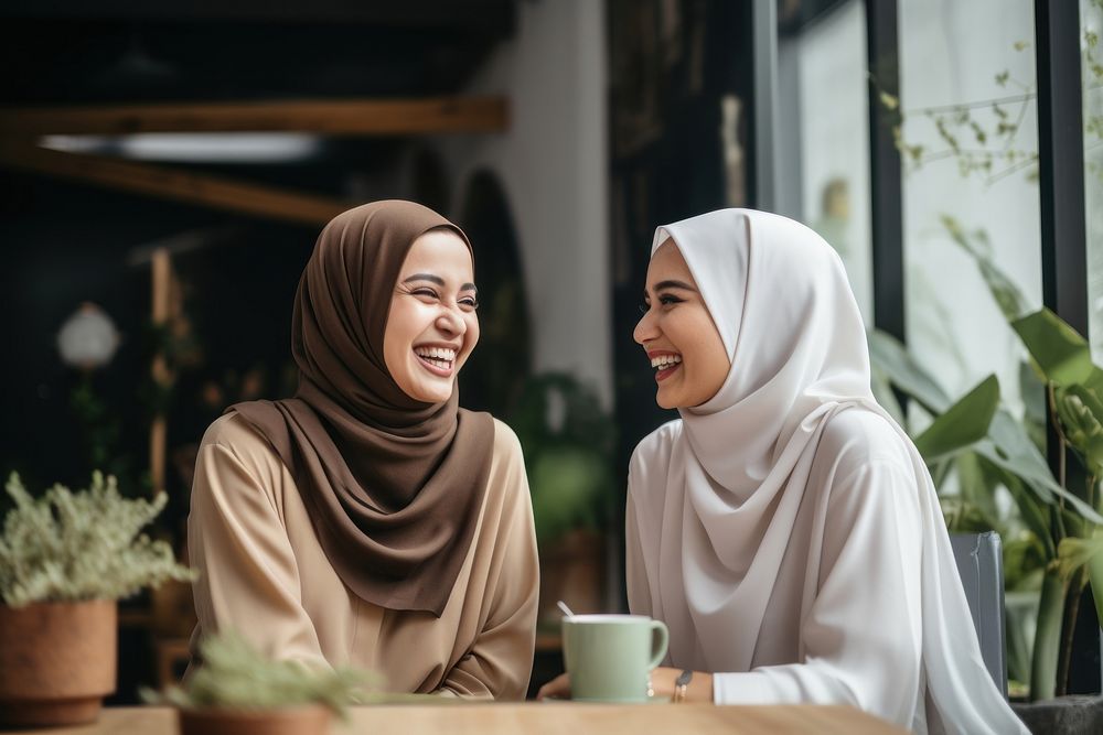 Two women wearing hurufiyya enjoy the moment with friendship laughing adult cup. AI generated Image by rawpixel.