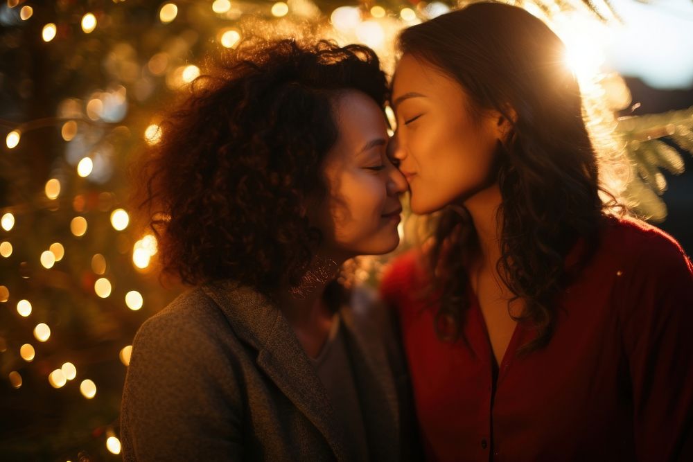 Asian sapphic couple portrait kissing christmas. AI generated Image by rawpixel.