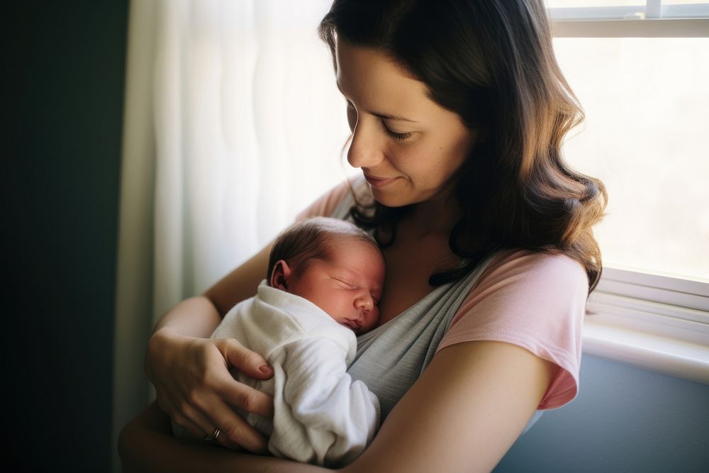 Mother tenderly holding her tiny baby with happy face portrait newborn adult. AI generated Image by rawpixel.