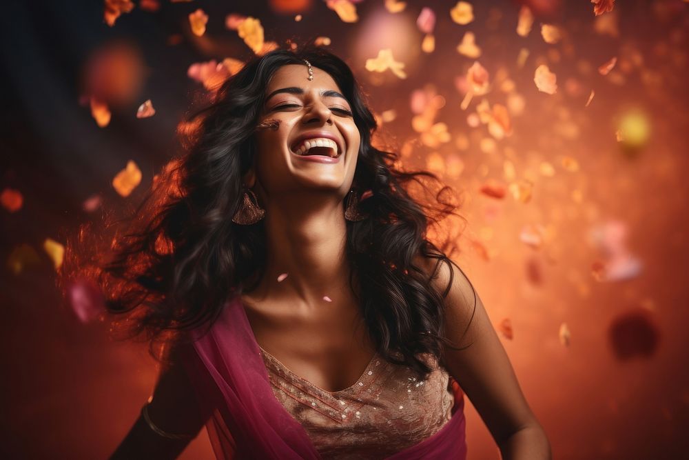 Indian woman gorgeous celebrating laughing adult illuminated. AI generated Image by rawpixel.