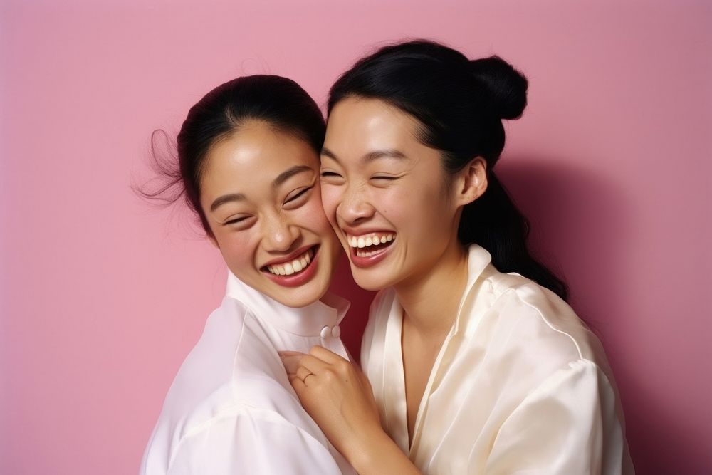 Asian sapphic laughing adult smile. AI generated Image by rawpixel.
