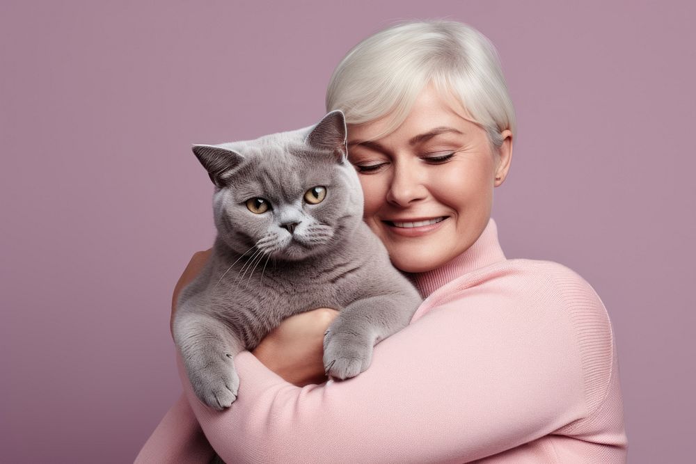 American middle age woman hugging british shorthair cat pet portrait animal. AI generated Image by rawpixel.