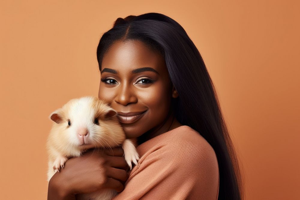 African woman hugging guinea pig portrait animal mammal. AI generated Image by rawpixel.
