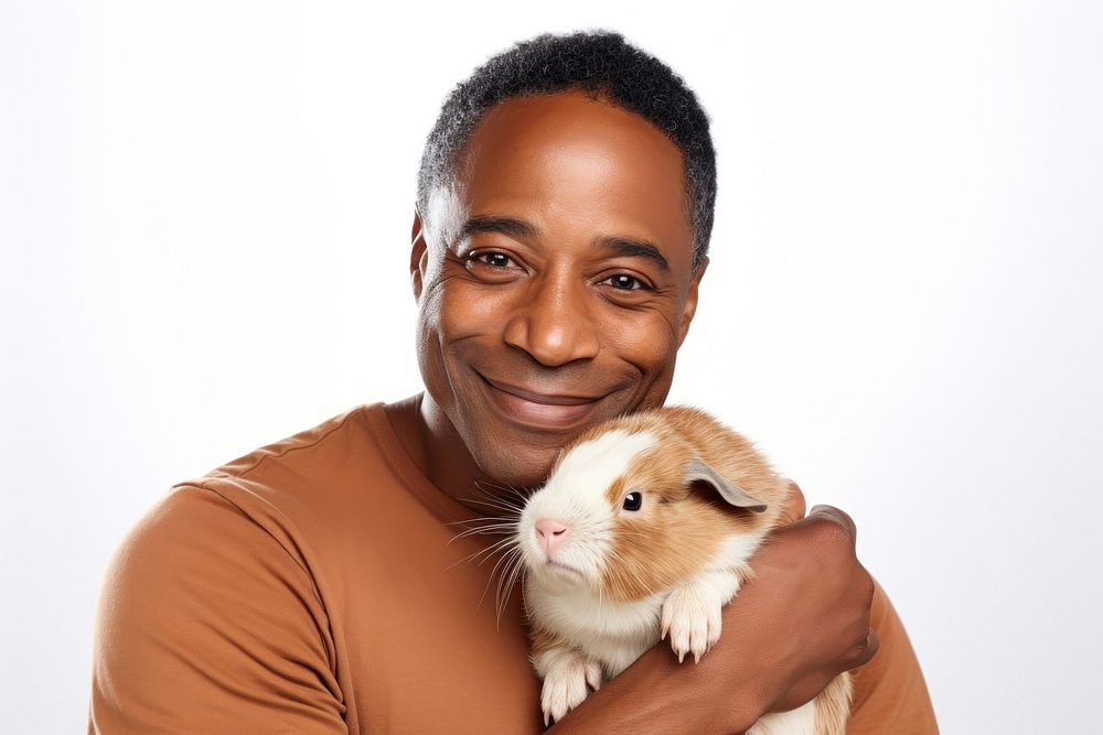 African american middle age man hugging guinea pig portrait animal mammal. AI generated Image by rawpixel.