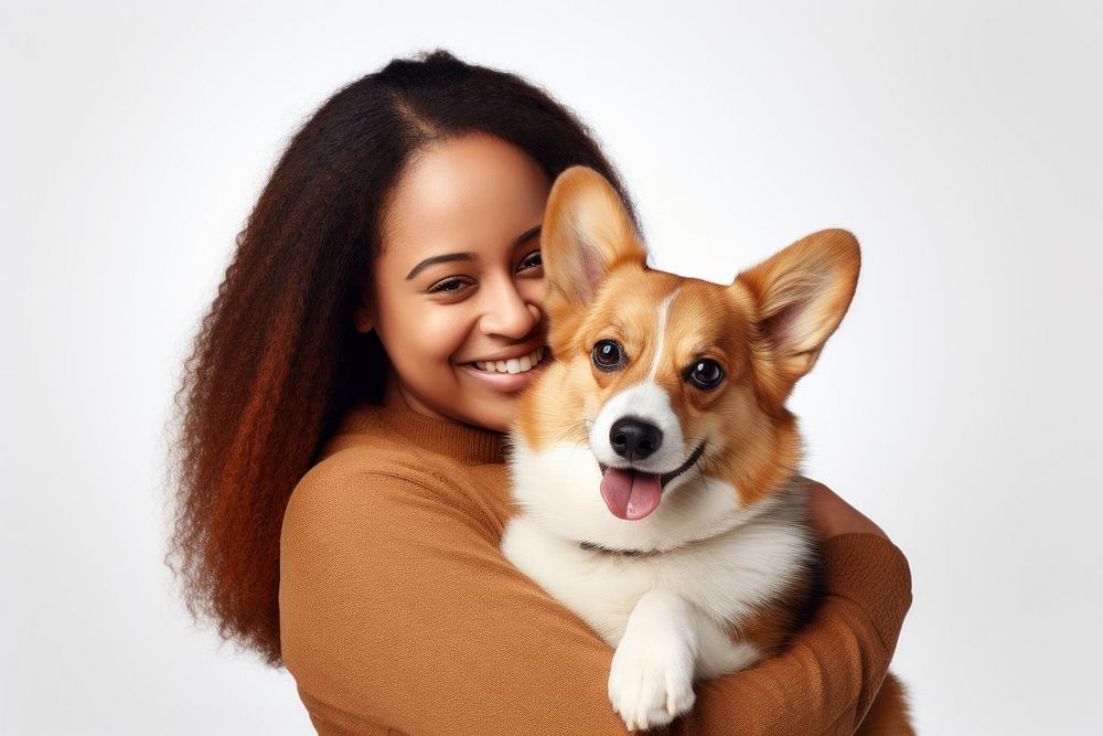 African american middle age woman hugging pembroke welsh corgi pet portrait looking. AI generated Image by rawpixel.