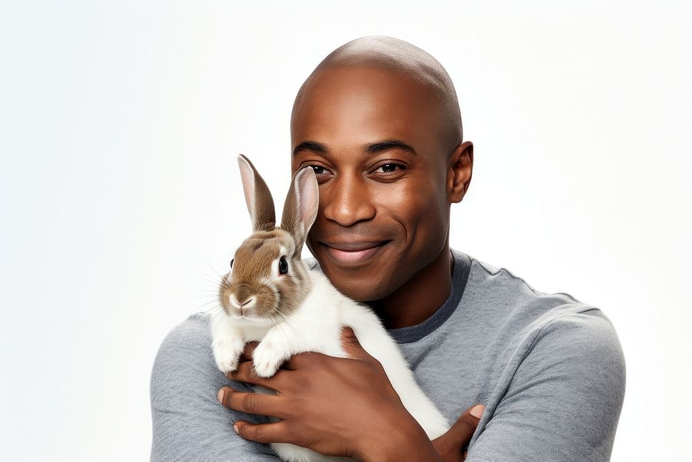 African american middle age man hugging rabbit portrait animal mammal. AI generated Image by rawpixel.