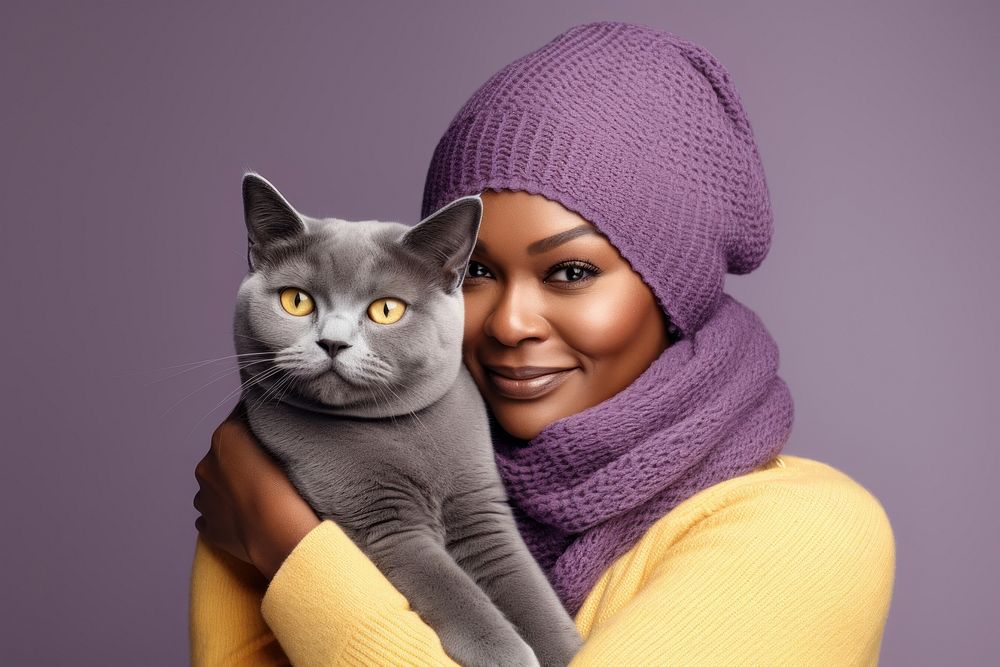 African middle age woman hugging british shorthair cat pet portrait mammal. AI generated Image by rawpixel.