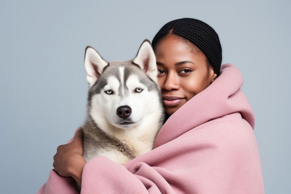 African middle age man hugging siberian husky pet looking mammal. AI generated Image by rawpixel.