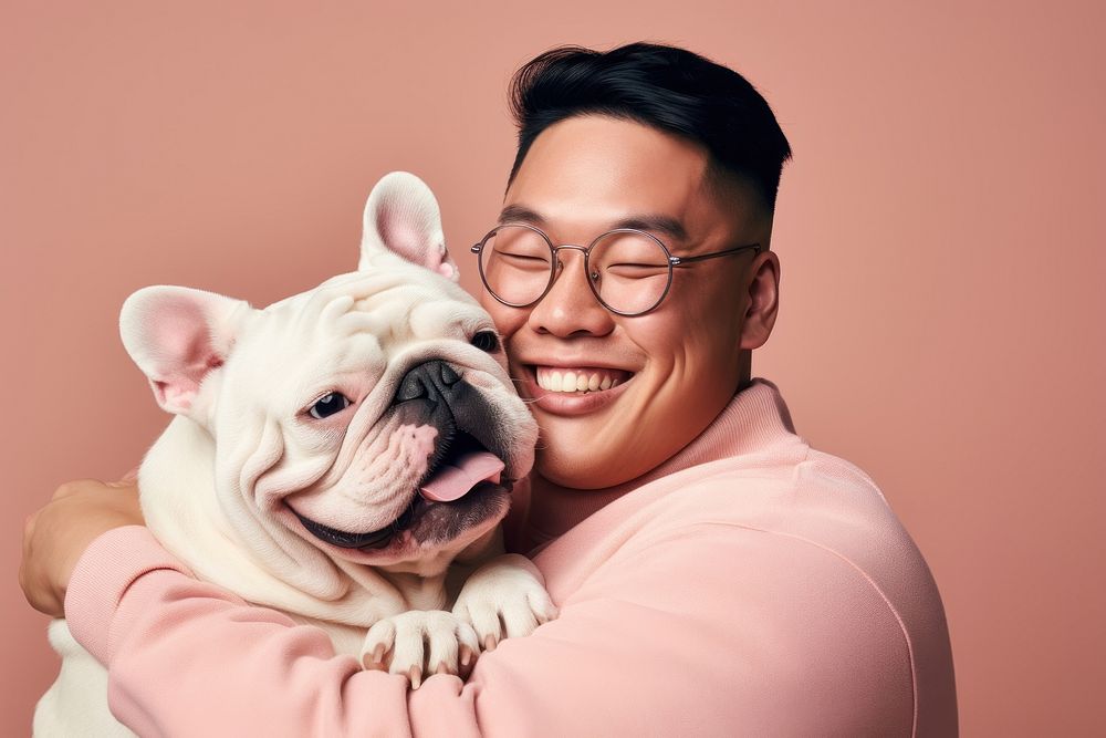 Asian man hugging bulldog pet portrait glasses. AI generated Image by rawpixel.