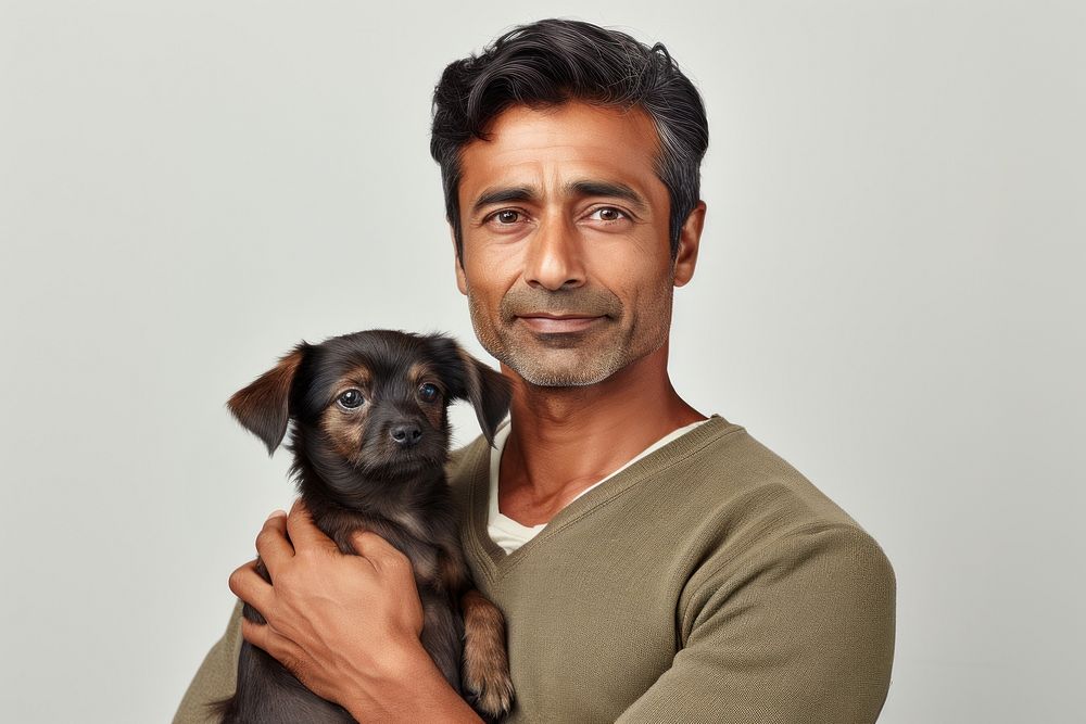 Indian middle age man hugging rabbit pet portrait mammal. AI generated Image by rawpixel.