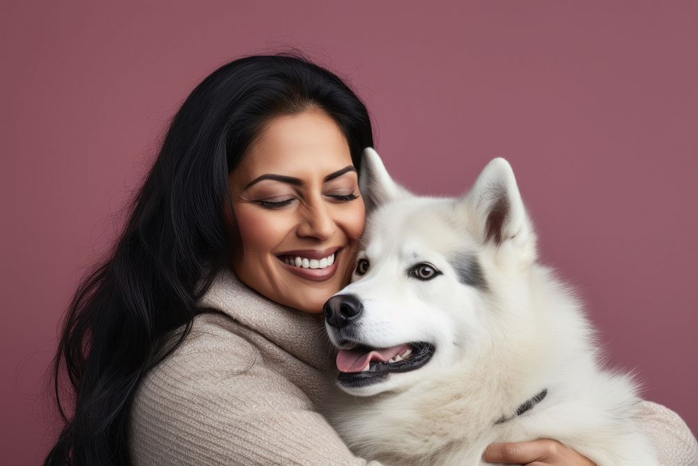 Indian middle age woman hugging siberian husky pet portrait looking. AI generated Image by rawpixel.