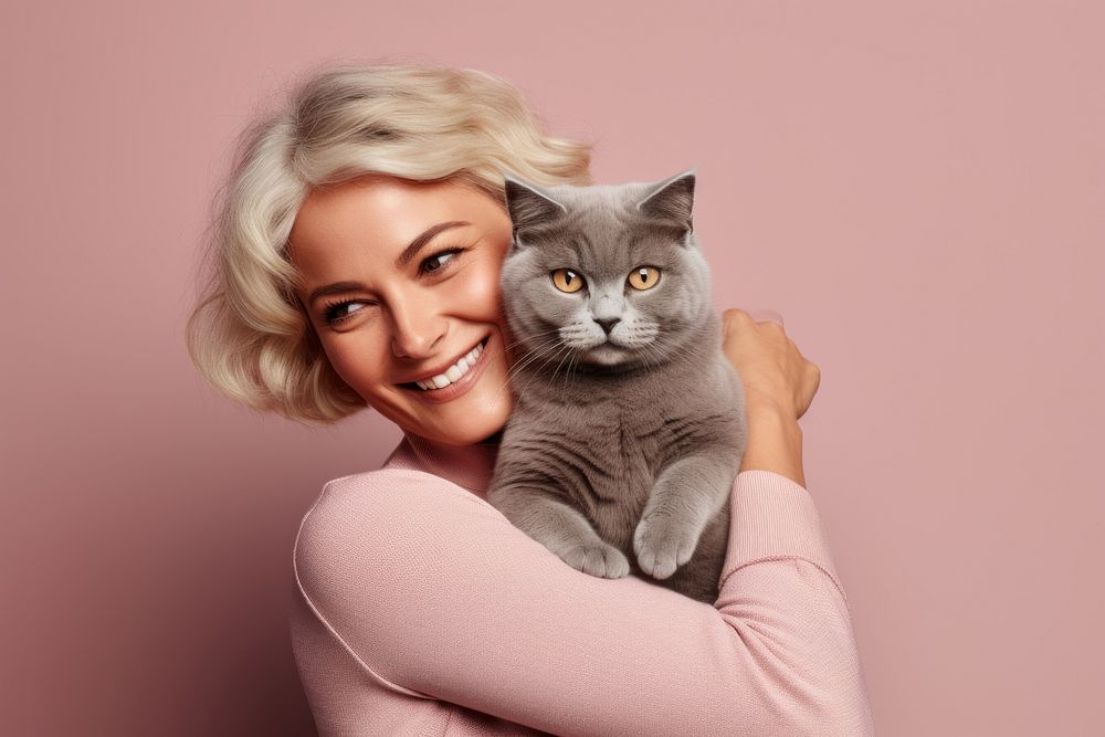 Middle east middle age woman hugging british shorthair cat pet portrait animal. AI generated Image by rawpixel.