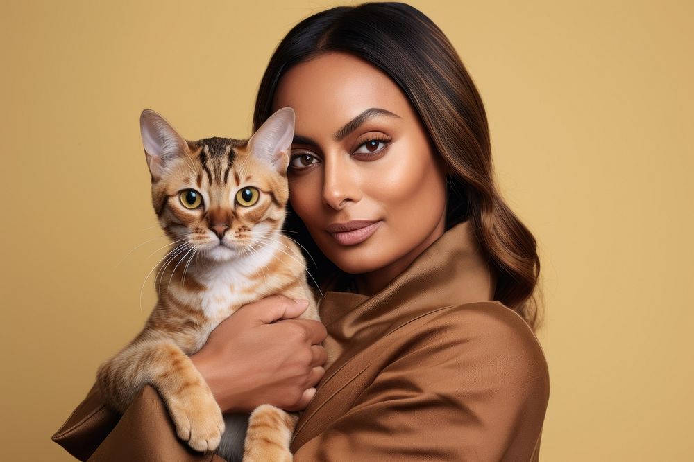 Middle east woman hugging bengal cat pet portrait looking. AI generated Image by rawpixel.