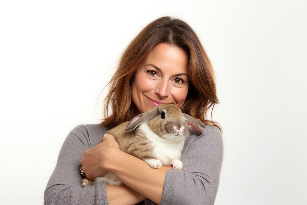 Spainish middle age woman hugging rabbit portrait mammal animal. AI generated Image by rawpixel.